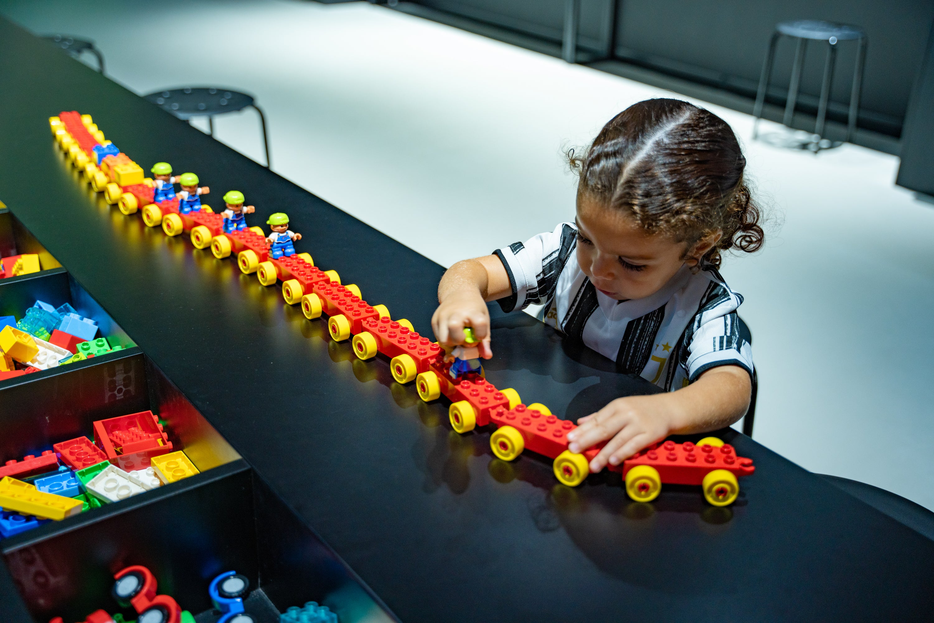 Children engaged in educational play at RoboVerse gallery