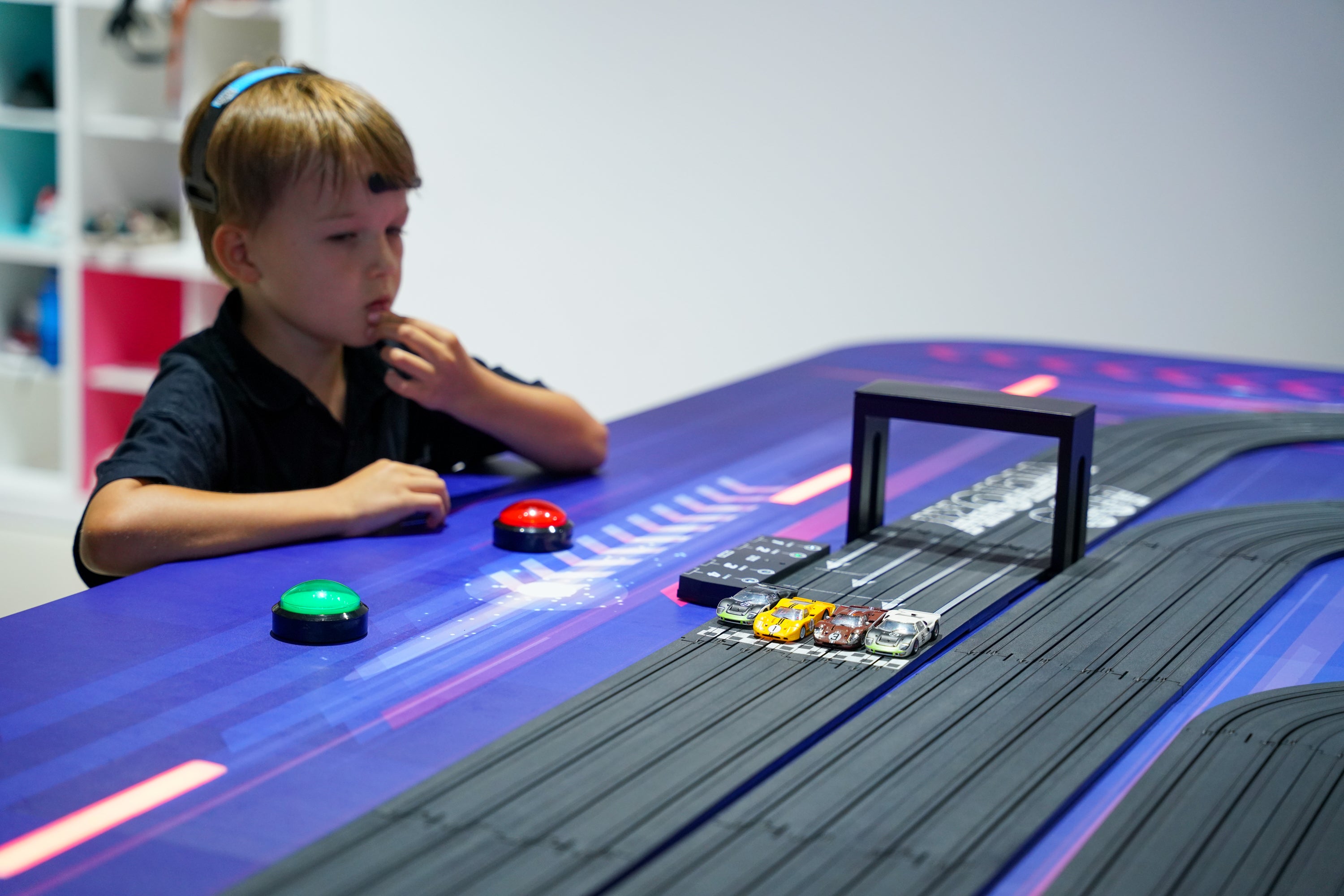 Interactive car racing for kids play at RoboFast gallery