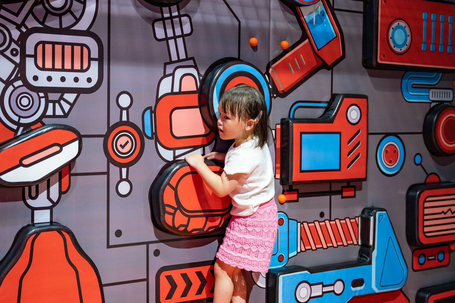 Young girl participating in hands-on educational play at RoboLand summer camps