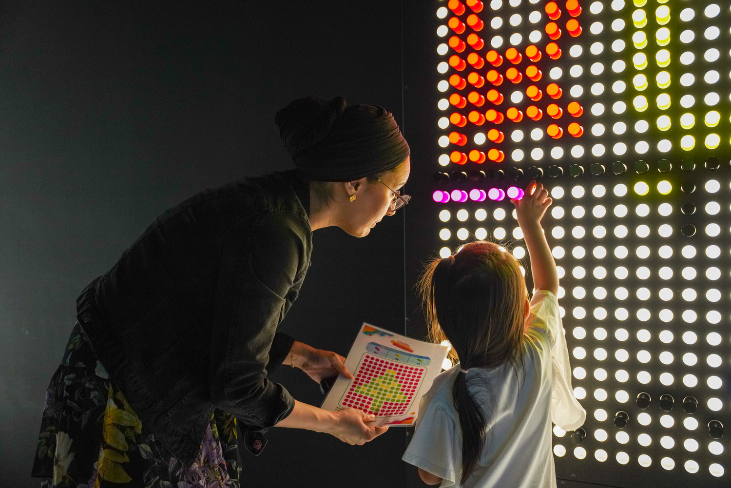 Adult and child playing together, gaining real-life tools at RoboLand edutainment center